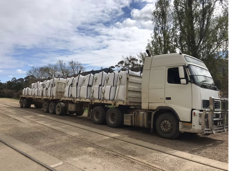 Truck and trailer loaded with bulk product bags ready for dispatch