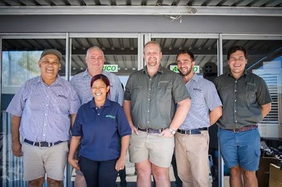 Branch team members standing outside the depot office